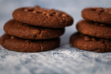 chocolate cookies on blue marble background,chocolate cookies stacked,Cookies with chocolate chips