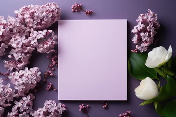 Fotobehang mockup white blank paper sheet with lilac flowers top view on purple background, floral template empty card flat lay for design with copy space © Маргарита Вайс