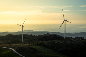 Landscape with renewable and sustainable energy with wind turbines on mountain, Portugal