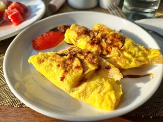 photo of omelet with a little sweet soy sauce and chili sauce