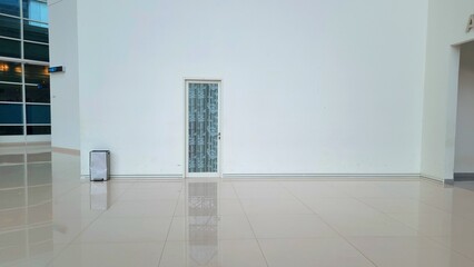 photo of a patterned door in the middle of a white wall