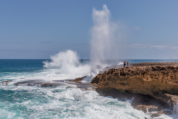 Quobba Blowholes (75km N of Carnarvon) spouting water - MacLeod, Western Australia
- caused by water being forced through sea caves by waves