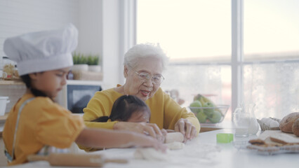 Grandma and granddaughter play kitchen