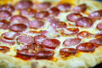 Traditional Brazilian pepperoni pizza in selective focus. Calabresa pizza.