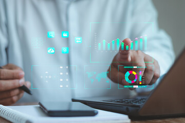 Analyst working with Business Analytics and Data Management System on computer, make a report with KPI and metrics connected to database. Corporate strategy for finance, operations, sales, marketing.