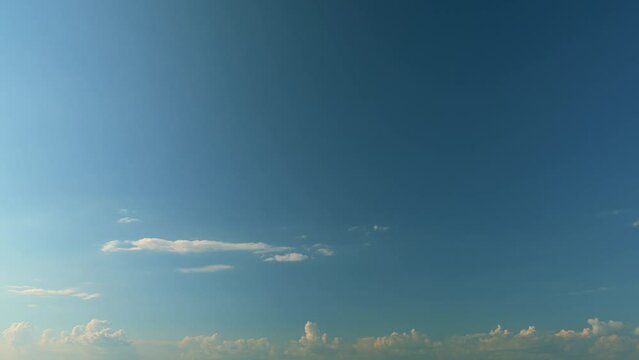 Blue Sky Background With Tiny Clouds. Low Angle View. Blue Clear Sky And White Clouds.