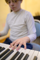 Boy with chickenpox playing piano