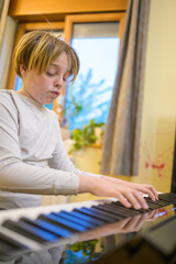 Boy with chickenpox playing piano