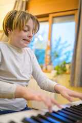 Boy with chickenpox playing piano