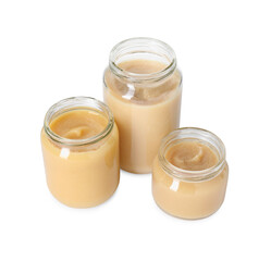 Baby food. Tasty healthy puree in jars isolated on white