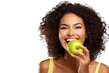 closeup beautiful happy woman in bright yellow top biting green crispy apple isolated on white background, concept of happiness, healthy food and losing weight