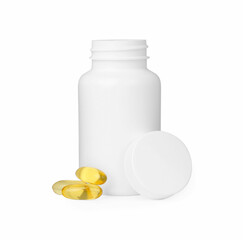 Blank jar and vitamin capsules isolated on white