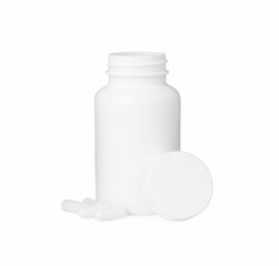 Blank jar and vitamin capsules isolated on white