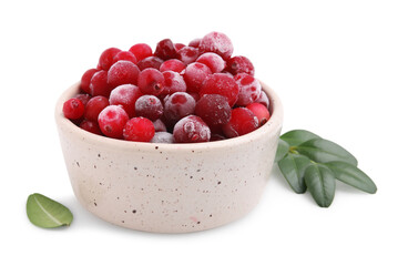 Frozen red cranberries in bowl and green leaves isolated on white