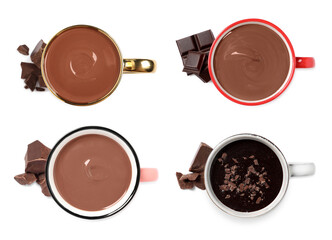 Delicious hot chocolate in cups isolated on white, top view