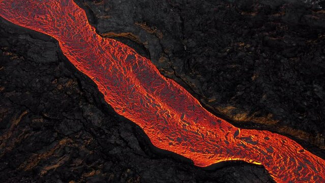 Incredible aerial of the dramatic volcanic eruption of the Litli Hrutur volcano eruption in Reykjanes peninsula Iceland. Flowing lava from the crater. Earthquakes.