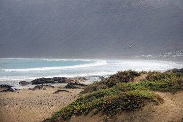 Landscape of the wild surf beach Famara in the north west of Lanzarote