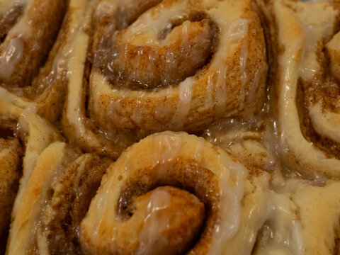 A closeup of a pan of fresh homemade vegan cinnamon buns. 