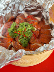 roasted duck in bamboo basket