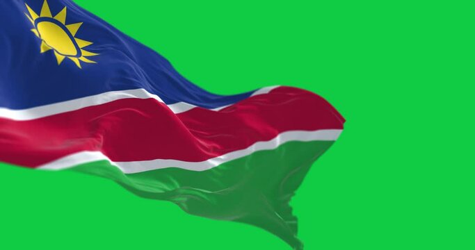 Namibia national flag waving isolated on green background