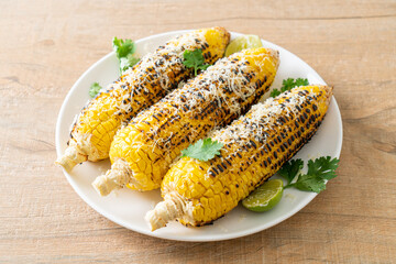 barbecue and grilled corn with cheese and lime