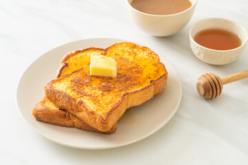 French toasted with butter and honey