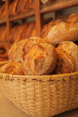Bread baguettes in a basket in the baking shop