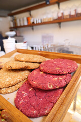 Many different cookies on trays display bakery cafe