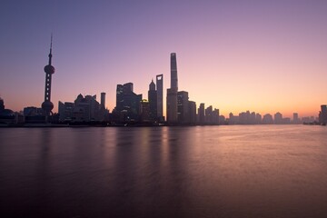 Fototapeta premium Shanghai Sunrise: A view of Shanghai business district on an early winter's morning.