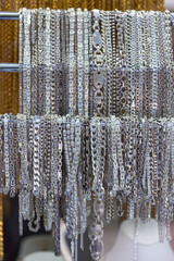 Jewelry shop window with a huge selection of silver  jewelry bracelets, chains