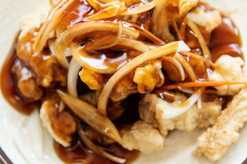 Close-up of  fried pork with onion and sweet sauce, one of the Chinese foods sold in Korea