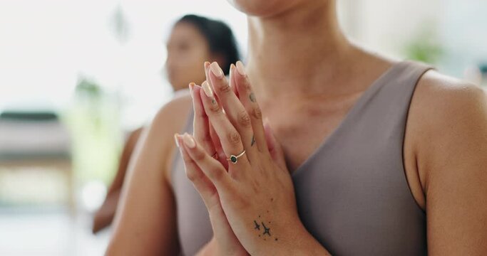 Women, yoga and prayer hands for meditation, holistic wellness and healing, hope or faith in studio. People in zen class with namaste or palm together for peace, calm and mindfulness in a closeup