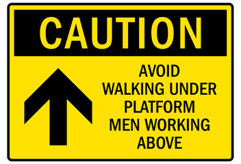 Men working above sign
