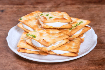 Scallion cookie nougats with tea on the plate  