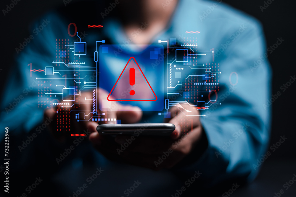 Wall mural system hacked warning alert. person use smartphone with virtual warning sign for cyber attack. ranso