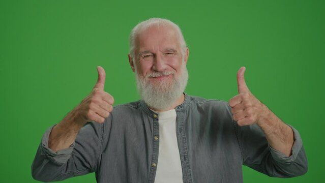 Green Screen. Portrait Of Smiling Old Man Showing Two Thumbs Up.Modern Elderly People Concept. Retirement with Pleasure and Without Worries. Pension Provision.