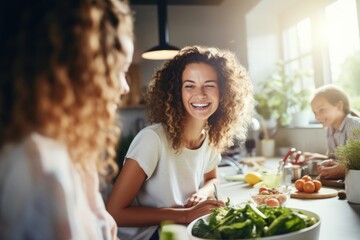 Women laughing while preparing healthy meal - obrazy, fototapety, plakaty