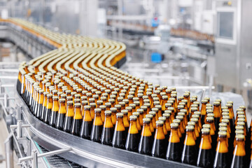 Brown glass beer drink alcohol bottles, brewery conveyor, modern production line