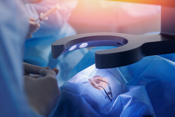 Process lasik treatment, laser vision correction. Doctor use equipment for fixing eyeball, patient...