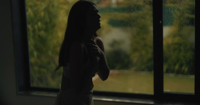 Indian sad angry upset young adult fail abuse woman lady sitting alone lost job crying dark indoor house tense lonely gen z female girl anger suffer heath issue hold head grief feel bad room home