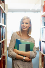 Woman, library and books, portrait for education and knowledge with smile on campus. College...