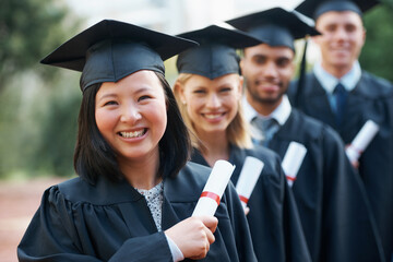 Graduation, certificate and portrait of group at college ceremony in line with diploma and...