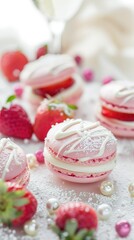 Strawberry macarons filled with a luscious strawberry ganache with white chocolate drizzle and dusted powdered sugar.