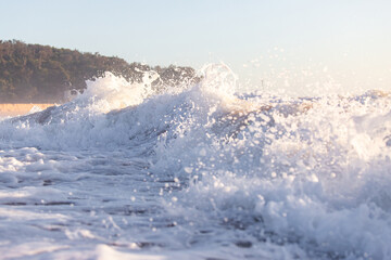Wave foam breaking on the shore.