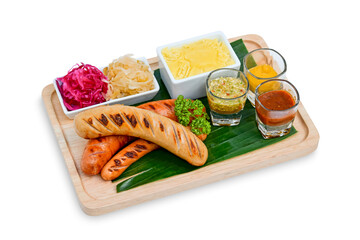 Grilled German sausages on wooden tray on white background