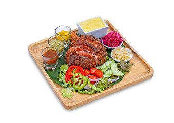 Pork knuckle with sauerkraut on  wooden tray on white background