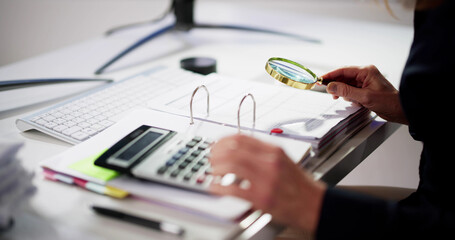 Auditor Using Magnifying Glass For Audit