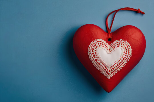 Heartfelt Valentine's Day. Red heart on blue background with copy space. Perfect for romantic messages. 