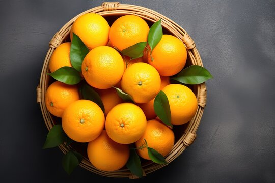 wicker basket with orange fruit on it above background and use it as your wallpaper, poster and banner design etc.