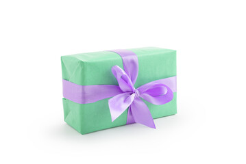 Green paper present box with violet ribbon bow isolated on white background
